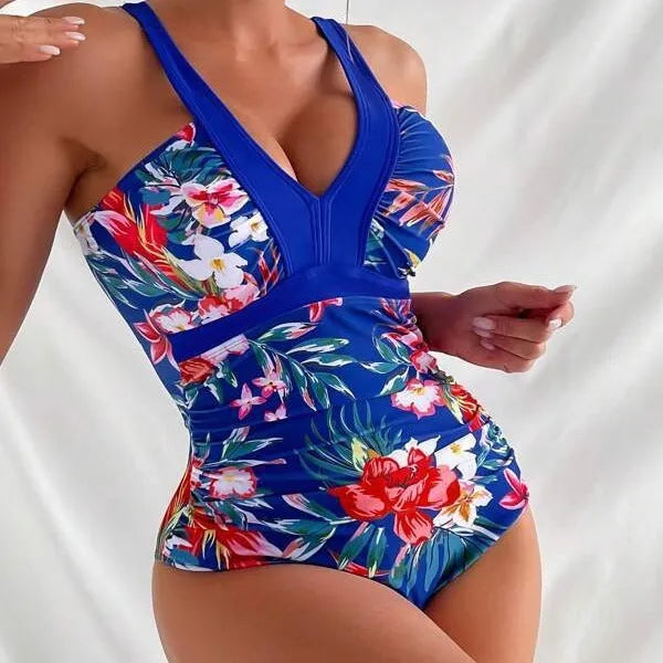 Women's floral one-piece swimsuit with backless design in black, blue, red, or rose red, showing high elasticity spandex material