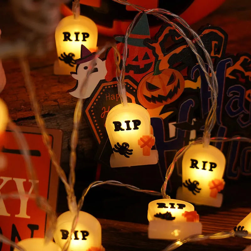 Halloween LED string lights with pumpkin, ghost and bat shaped covers, battery operated, PVC shell, warm white.