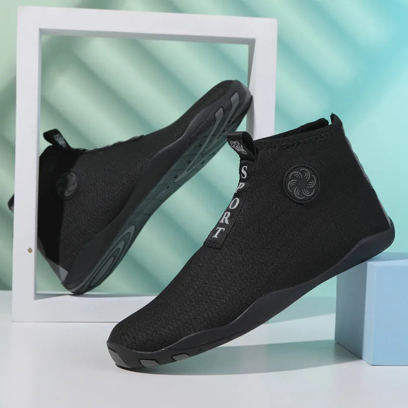 Outdoor beach shoes in black and fluorescent green with mesh upper and rubber sole.