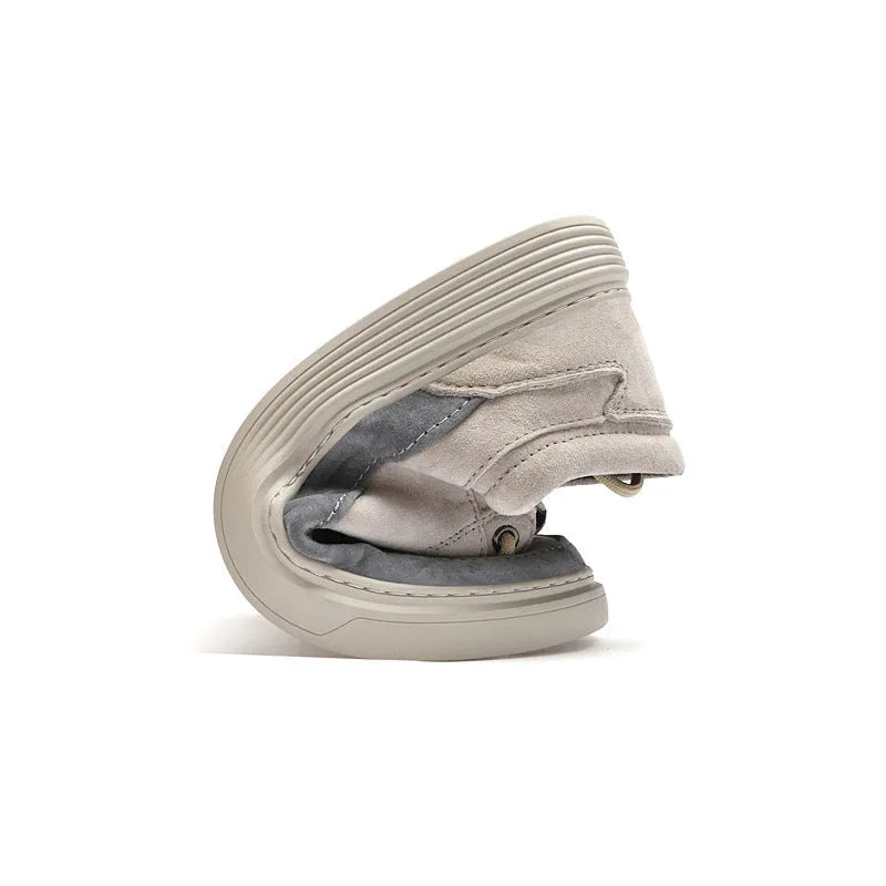 Men's grey casual skate shoes with pigskin upper and rubber sole showing lace-up front and round toe design