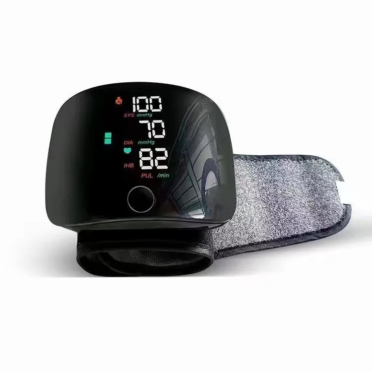 Black wrist blood pressure monitor with USB charging port and multiple voice language options