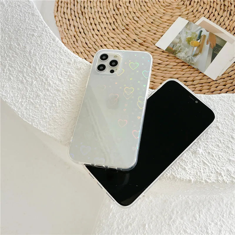 Laser-etched love design on transparent silicone iPhone case showing precise port cutouts