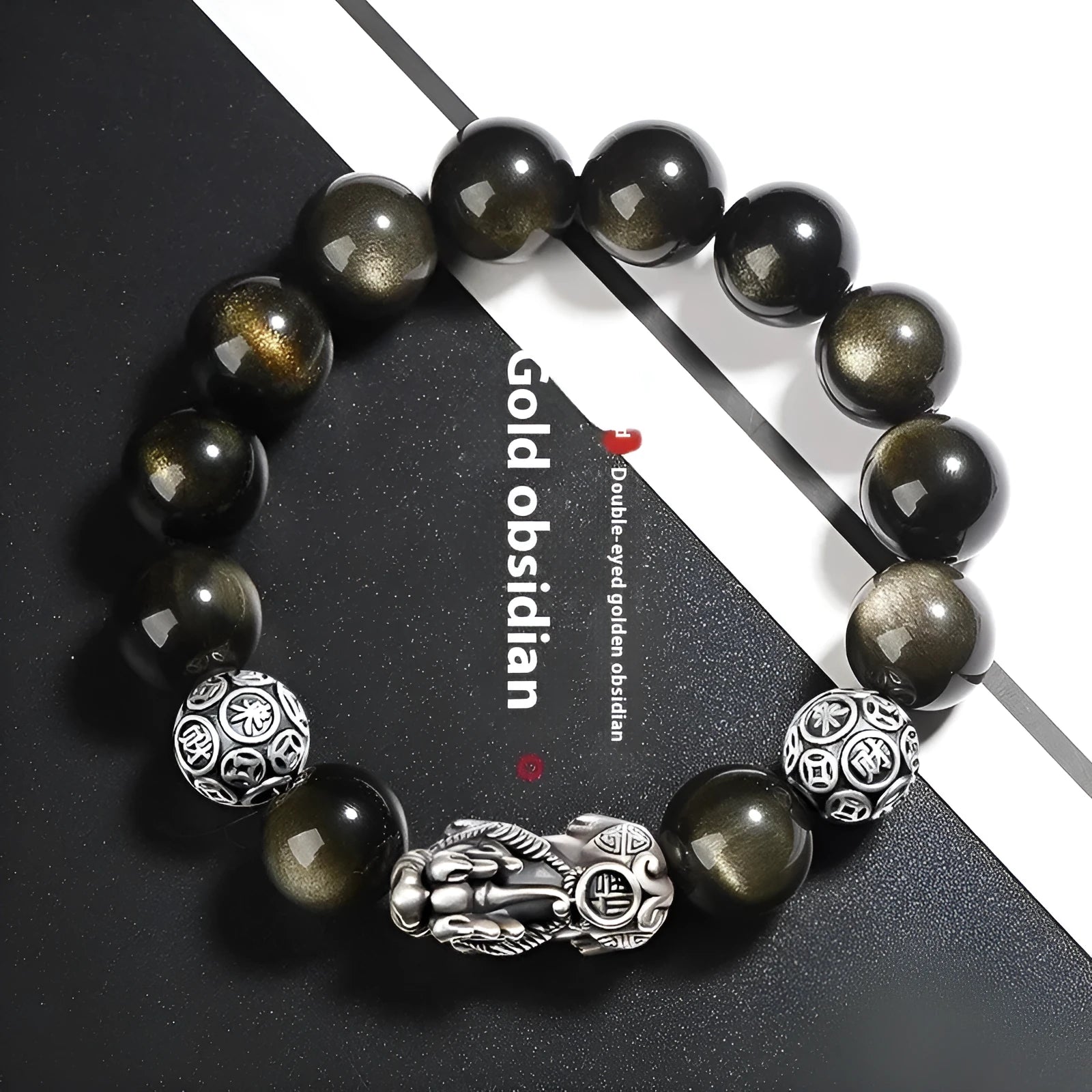 Men's geometric obsidian bracelet in sterling silver showing polished finish and natural stone detailing