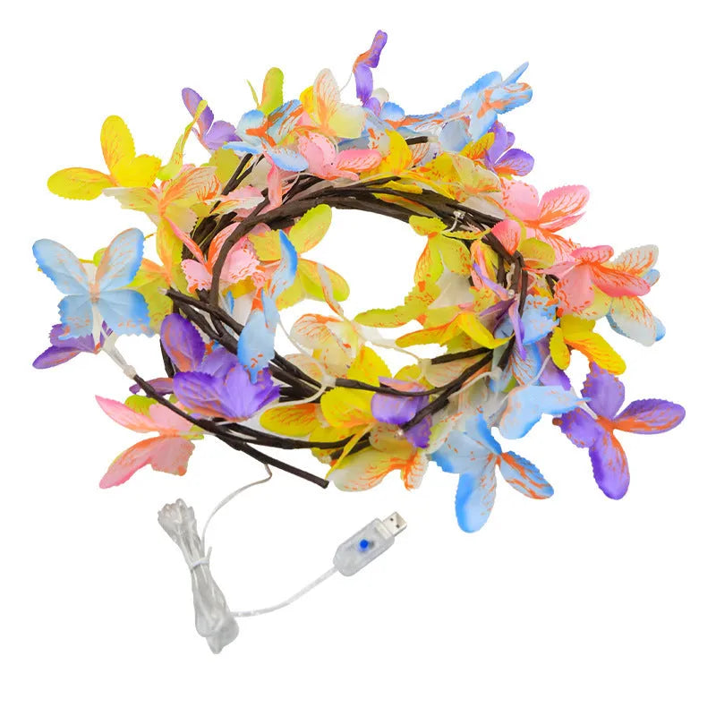 1.8 metre tall flexible rattan tree lamp with colourful LED butterflies, showing bent branches.