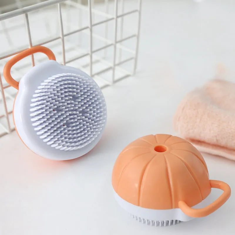 Orange TPR dog bath brush with shampoo dispenser and comb teeth for pet grooming