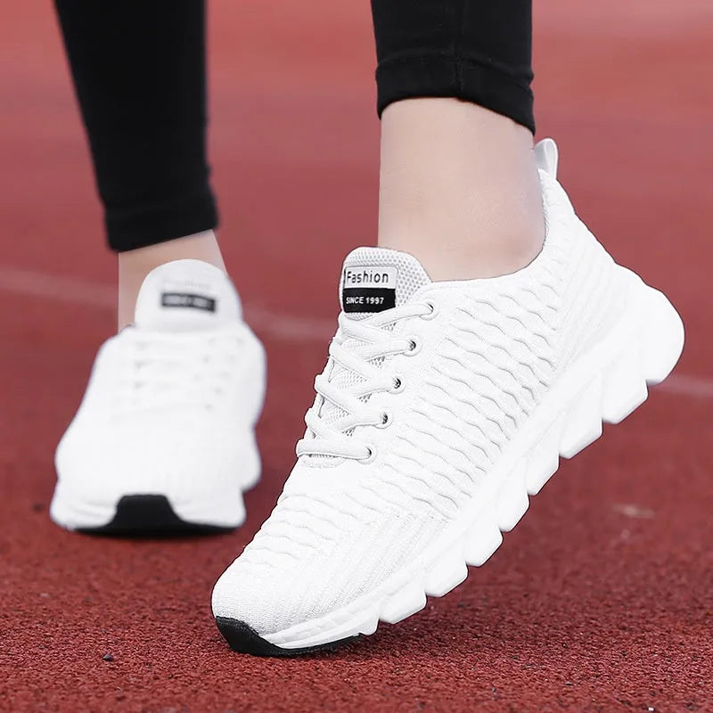 Women's running shoes with fly weaving upper in black, pink, or white, showing wear-resistant outsole