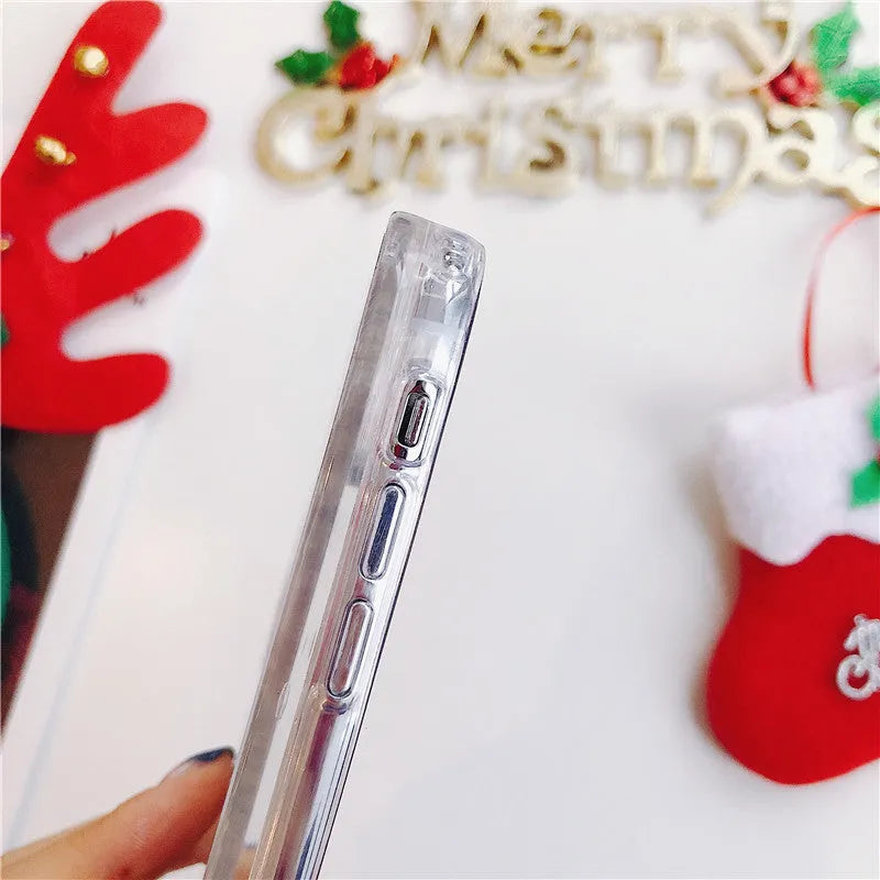 Transparent Christmas quicksand iPhone case with Santa Claus snowflake design on iPhone