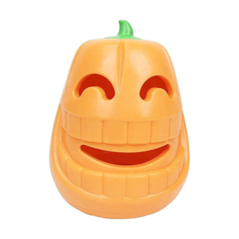 Orange Halloween pumpkin-shaped dog toy with textured surface and treat-dispensing funnel opening