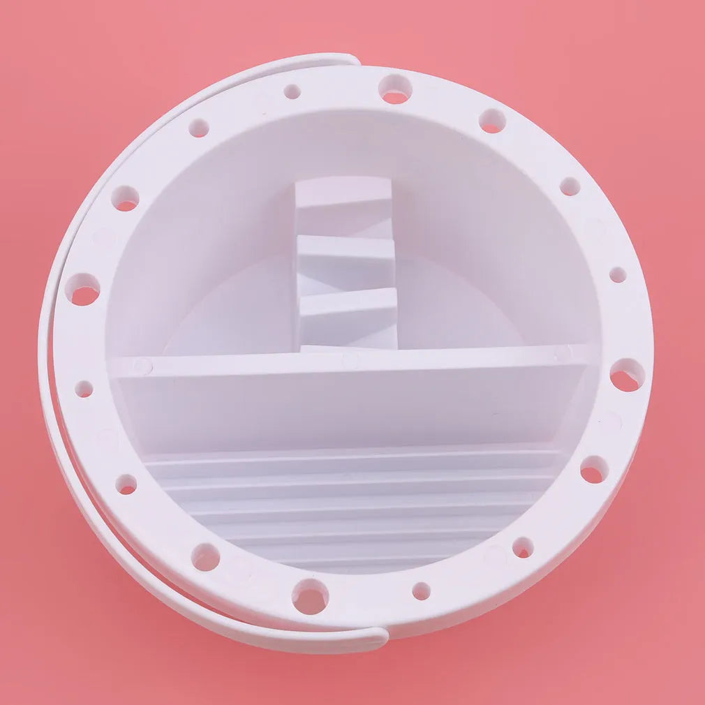 White plastic cylindrical brush holder with a side clip for painting.