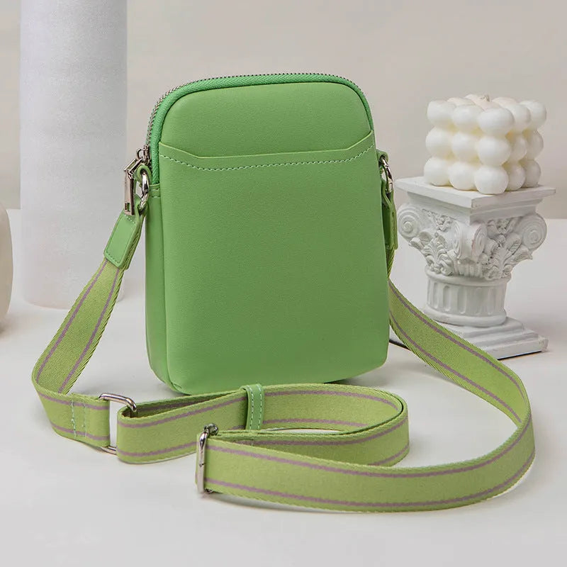 Solid colour mobile phone crossbody bag with adjustable strap, compact 14.5x5.5x19cm dimensions