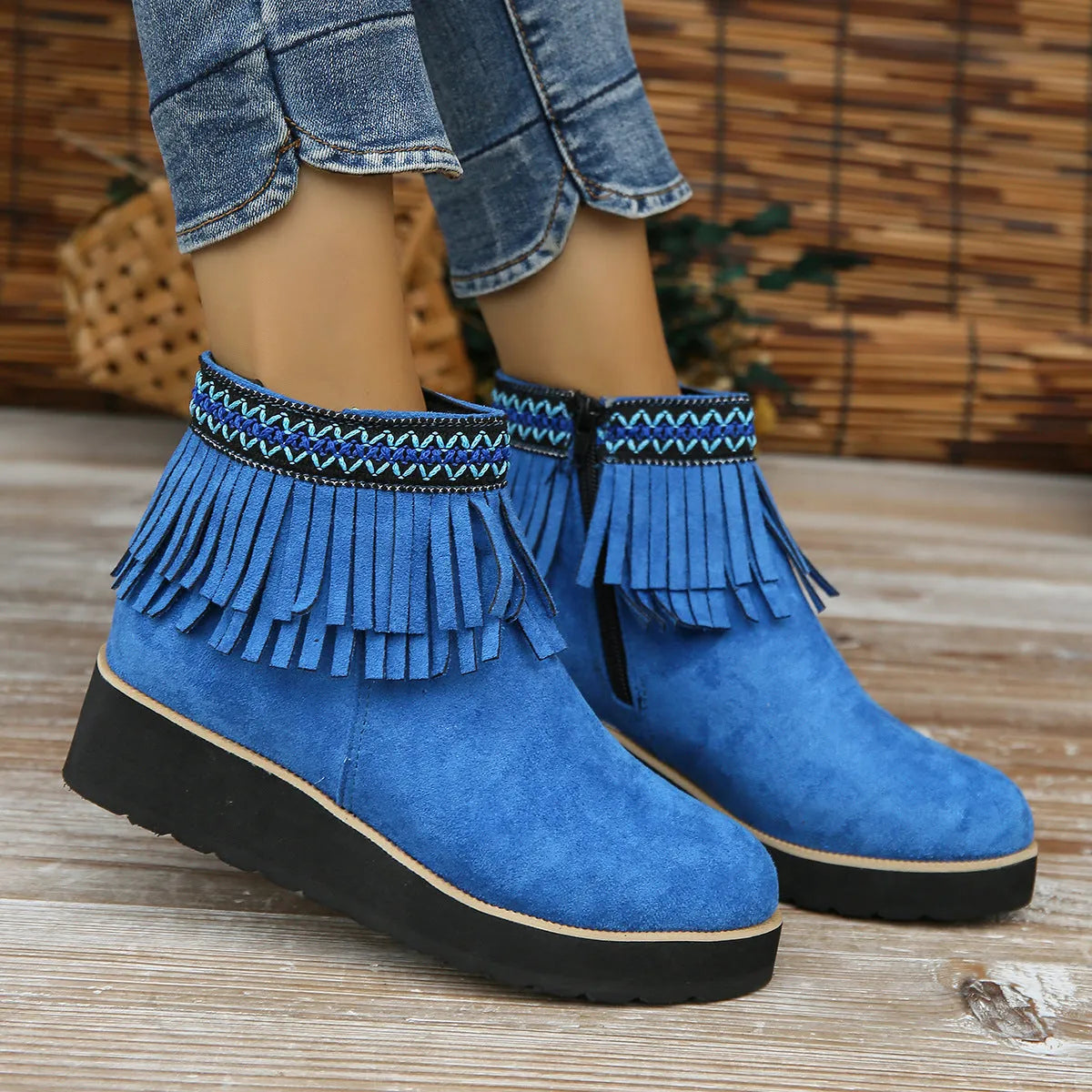 Women's suede wedge bootie in dark brown with side zipper and tassel detail on a 4cm rubber sole