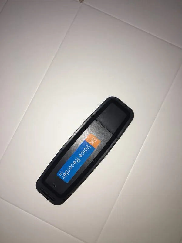 Black and white creative USB flash drive with voice card function showing compact plastic design.