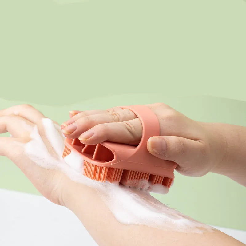 Blue silicone scalp massager brush with long bristles and a hand-through ergonomic handle.
