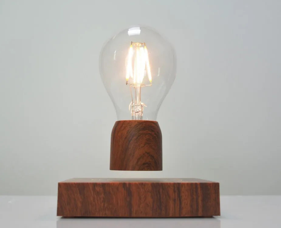 Magnetic levitation bulb floating above imitation wood base with ABS and glass construction, EU CE certified for 100-240V operation