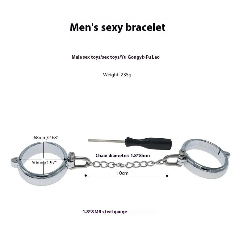 Silver zinc alloy handcuffs and footcuffs set with stainless steel chain linking on black background