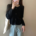 Women's long-sleeved acrylic cardigan coat in free size showing front opening and regular sleeve design