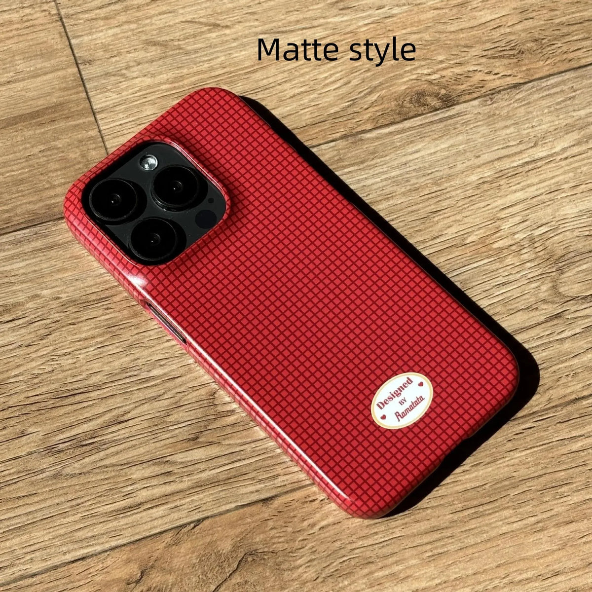 iPhone 15 Pro Max case with red and orange plaid pattern in glossy and frosted finishes