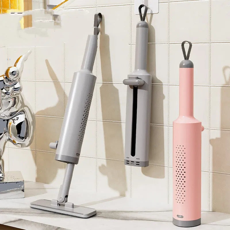 Pink self-squeeze mini mop with microfiber pads and crevice brush for floor cleaning