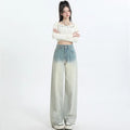 Women's gradient blue straight-leg denim trousers showing colour transition and straight cut silhouette