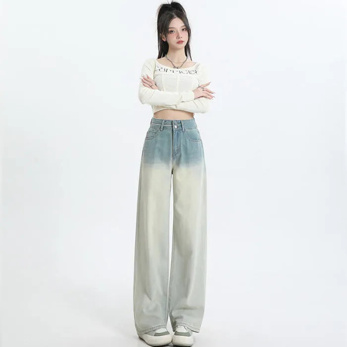 Women's gradient blue straight-leg denim trousers showing colour transition and straight cut silhouette