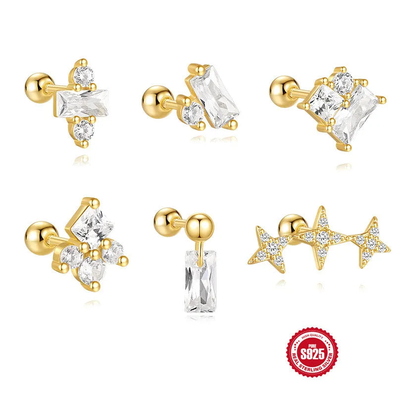 Close-up of women's sterling silver flower stud earrings with square gravel texture in a gold colour.