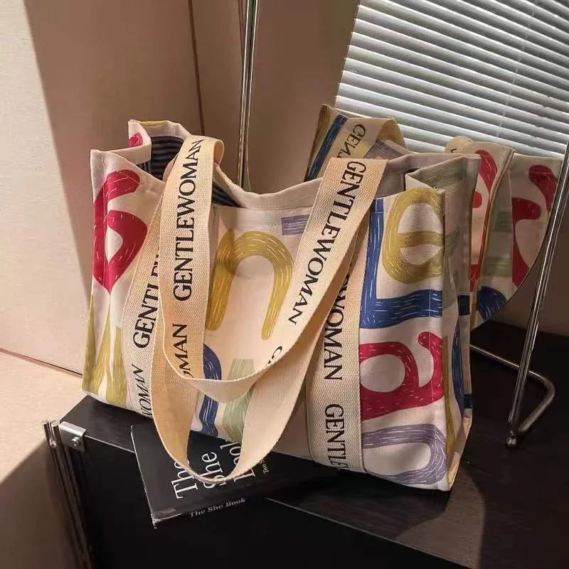 Canvas women's tote bag with printed design showing 45cm width and shoulder strap