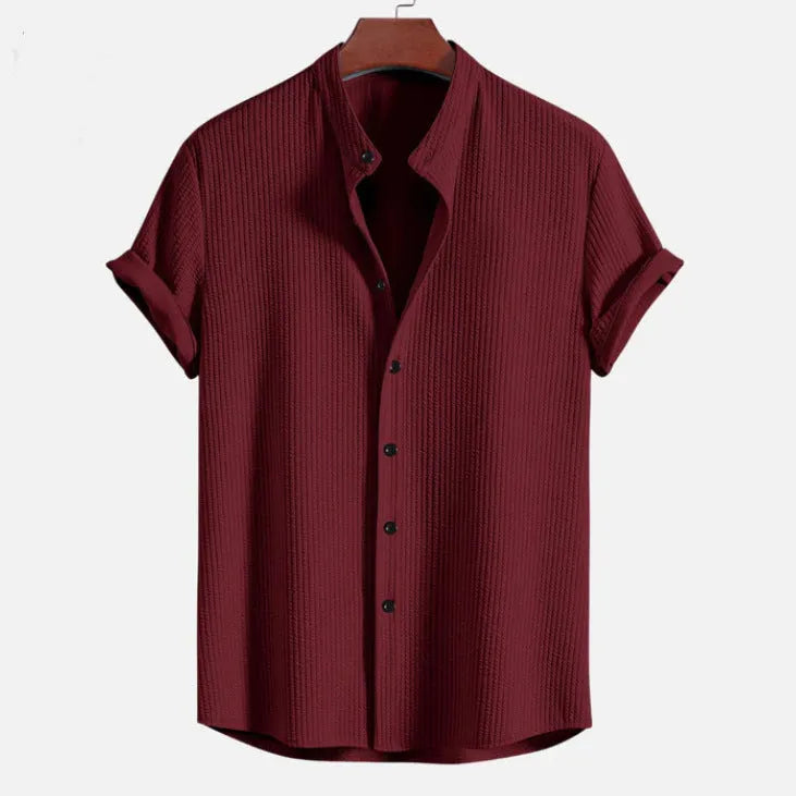 Men's loose fit short sleeve shirt in polyester fibre, available in nine colours including wine red and navy blue