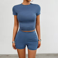 Women's solid colour slim viscose sports set with short sleeve T-shirt and elastic shorts.
