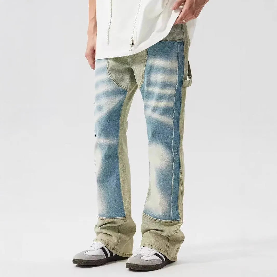 Retro dual-colour patchwork jeans with yellow and blue sections, splash-ink patterns, and distressed detailing on mid-waist denim trousers