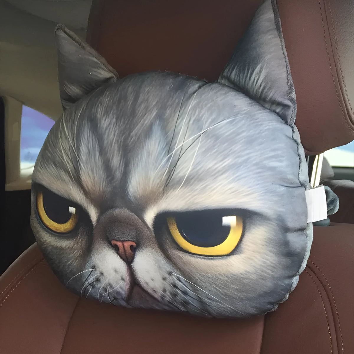 Handmade oblong car headrest pillow with printed cartoon cat design, polyester cotton cover, and PP cotton filling.