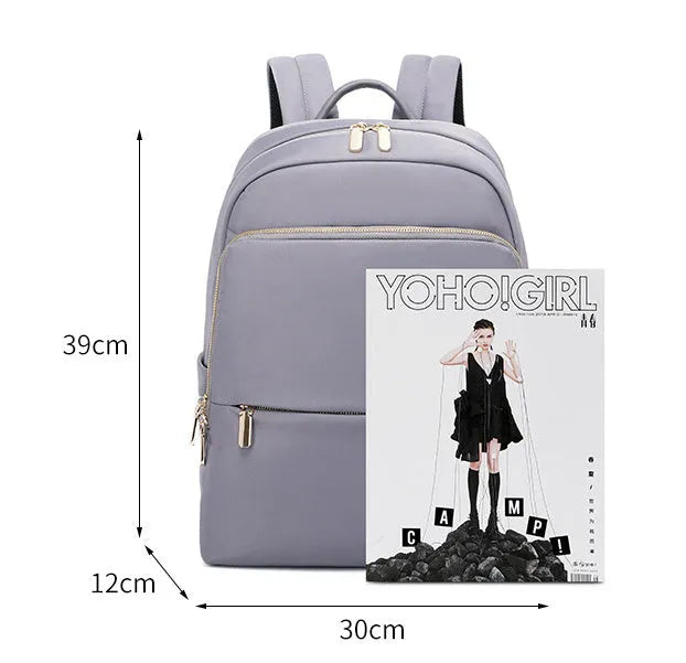 Classic black women's Oxford cloth backpack with large main compartment and breathable back panel.