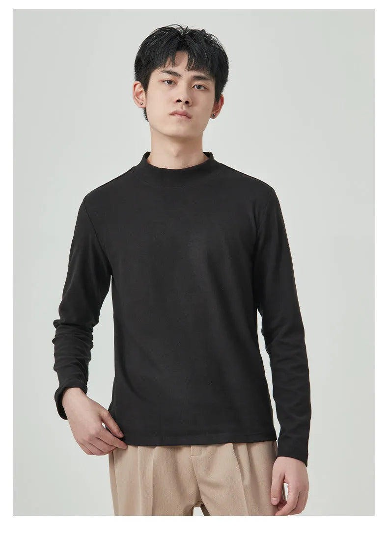 Man's brown long sleeve Dralon T-shirt with a half-high collar, laid flat.