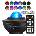 Small black starry sky projection lamp on desktop with rotating water ripple laser effects and remote control
