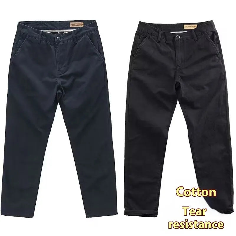 Men's slim-fit casual trousers in a micro elastic fabric, shown in a straight-leg cut and solid colour.