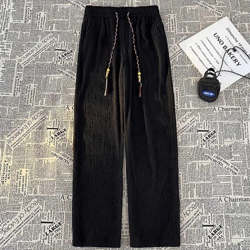 Men's Korean style summer trousers in loose straight-leg fit with drooping texture detail