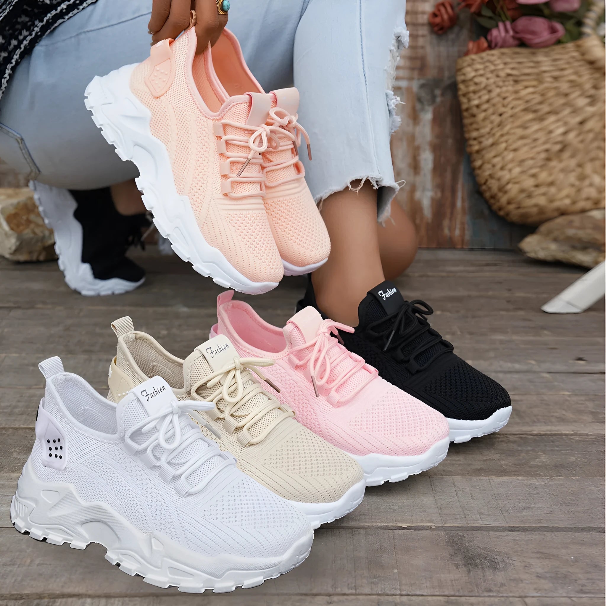 Women's white Flyknit mesh casual sports shoes with flat heel and lace-up front.