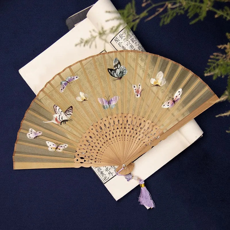 Traditional bamboo folding fan with Su embroidery showing butterfly pattern, 7 inches when open