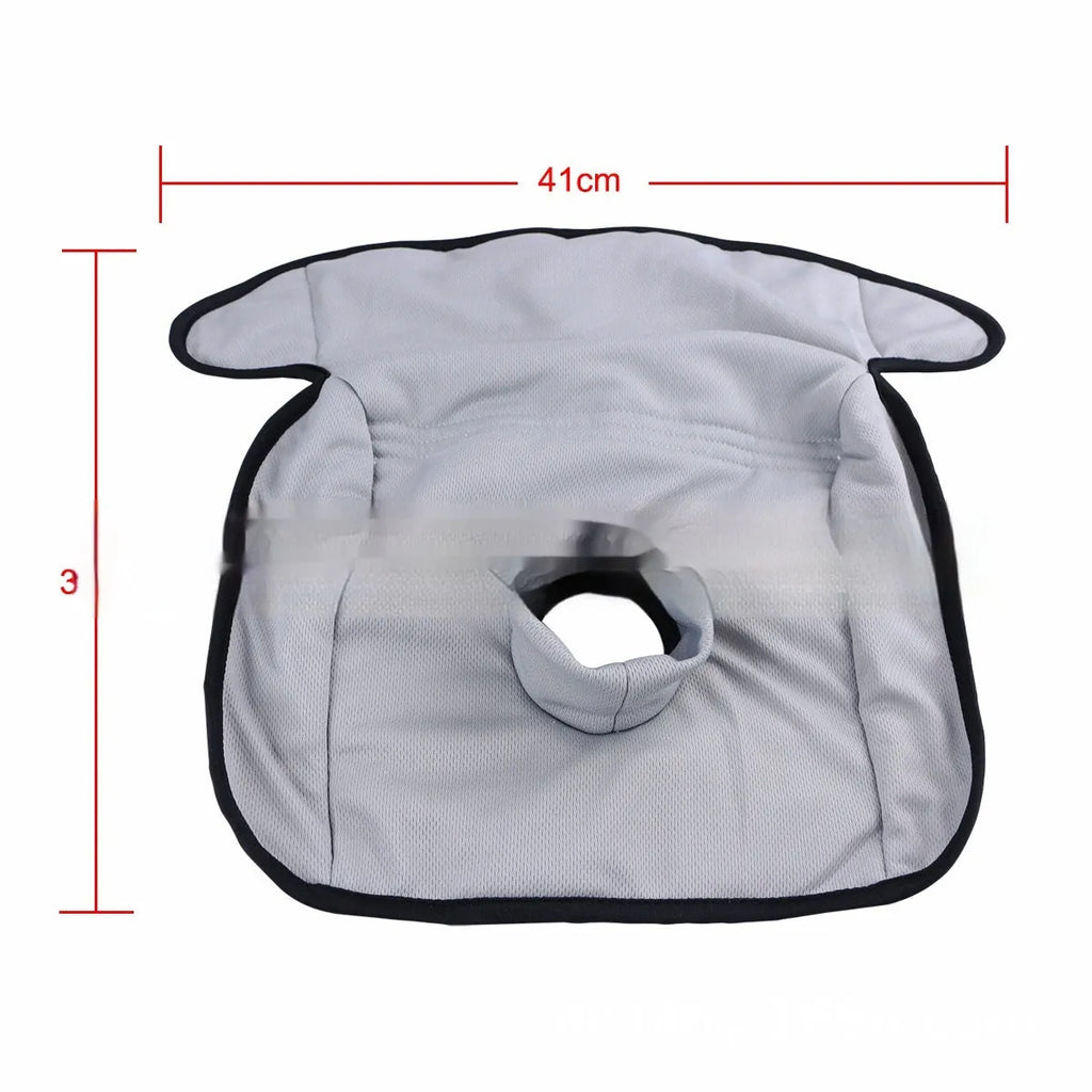 Alien-shaped grey car seat protective pad with urine-separation layer on a car seat.