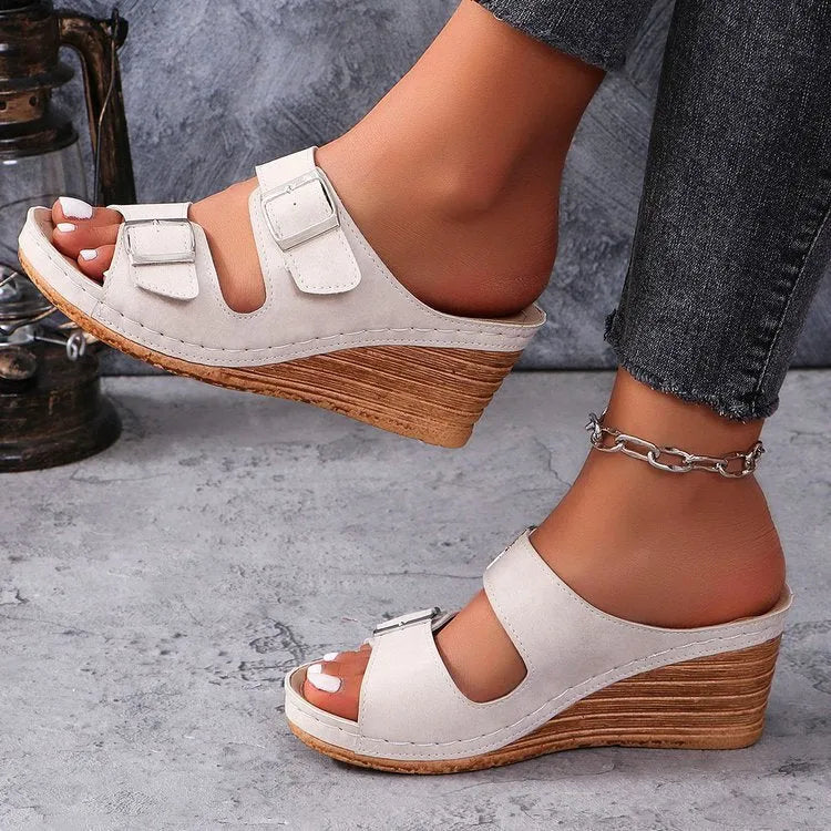 Women's wedge sole beach slippers with decorative outer buckle in creamy-white colour