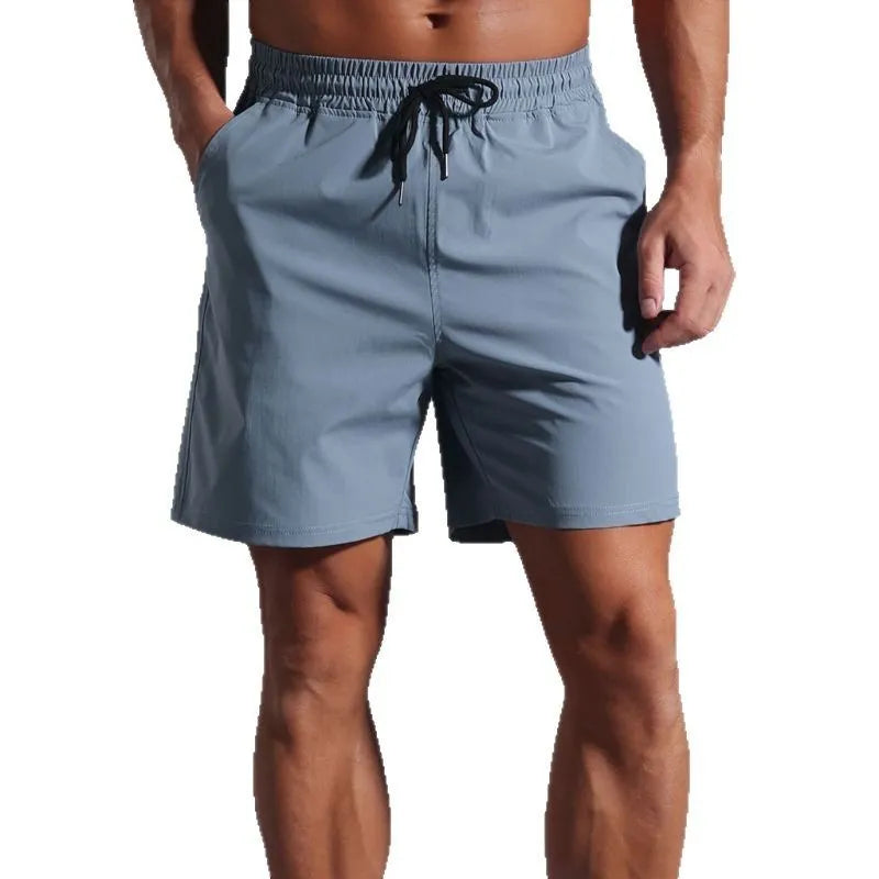 Man wearing loose khaki casual shorts made from quick-dry polyester fabric.