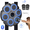 Black smart boxing target mounted on wall with Bluetooth connectivity and light feedback system