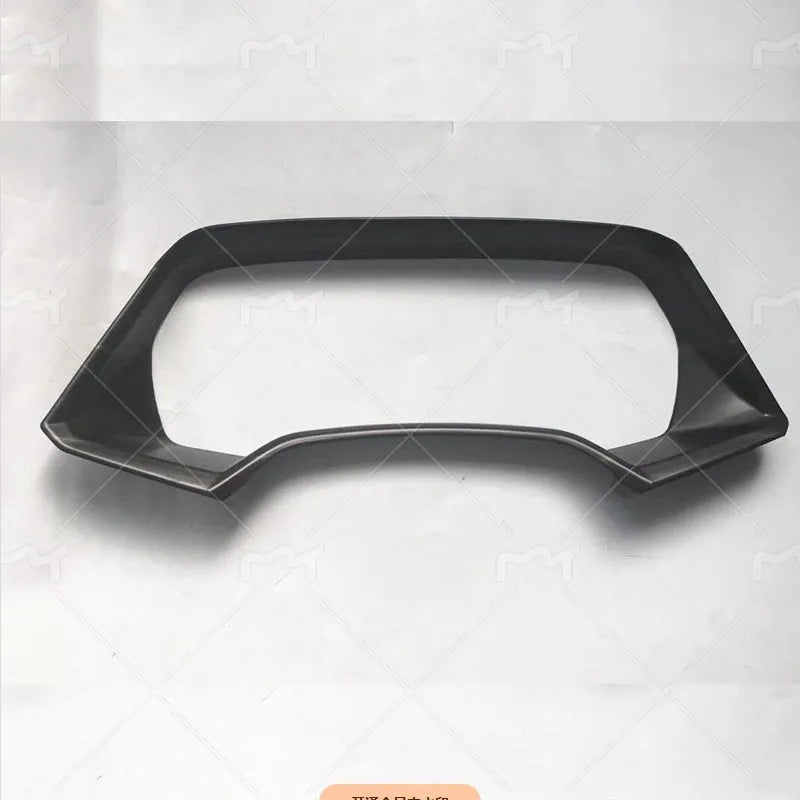 BMW X5 dashboard decorative frame in carbon fibre or peach wood finish