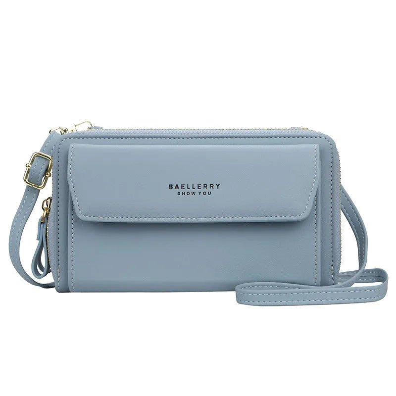 Red ladies long wallet with cross-body strap showing dual zippers and multiple internal pockets for organisation