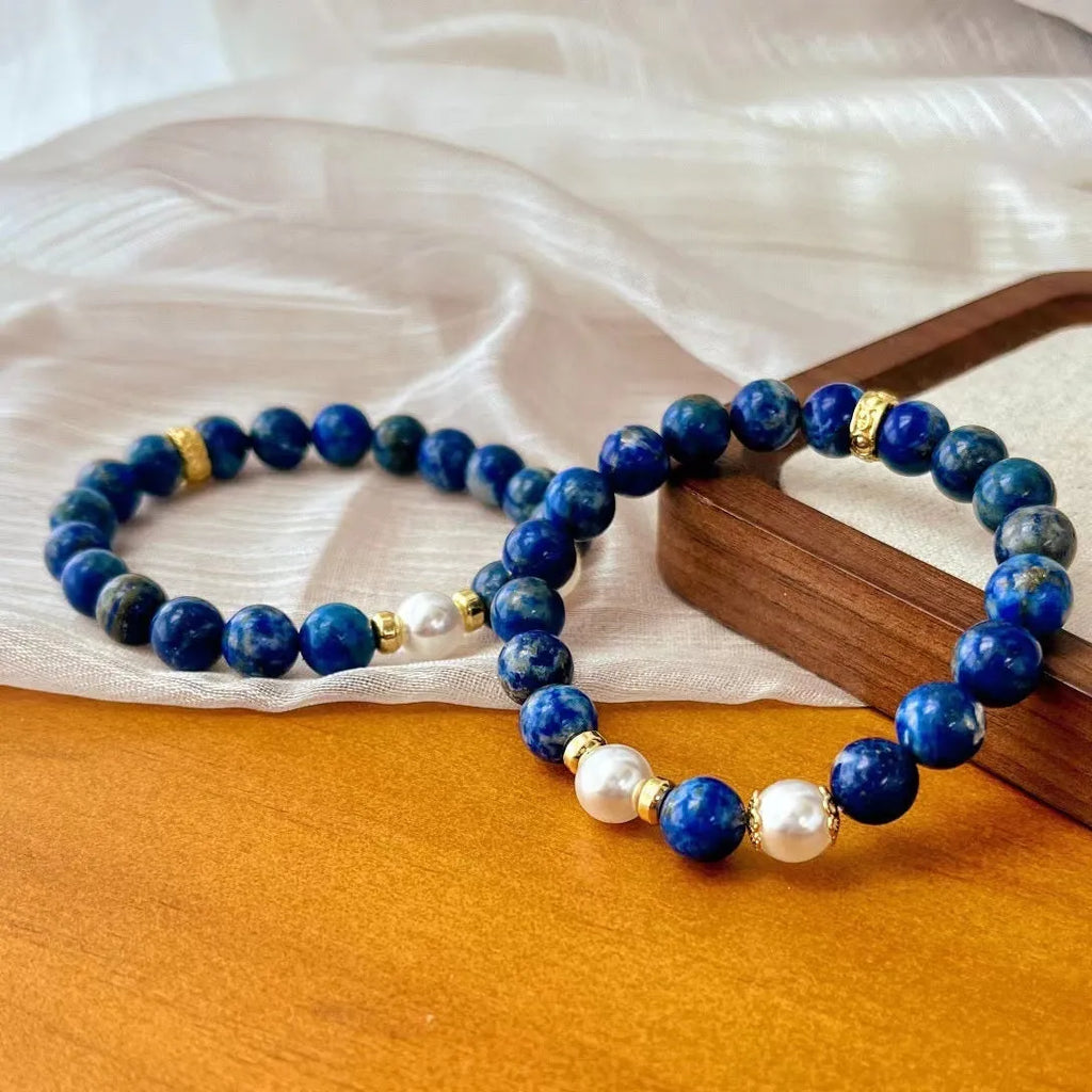 Chinese style artistic retro bracelet made with genuine blue and gold lapis lazuli beads.