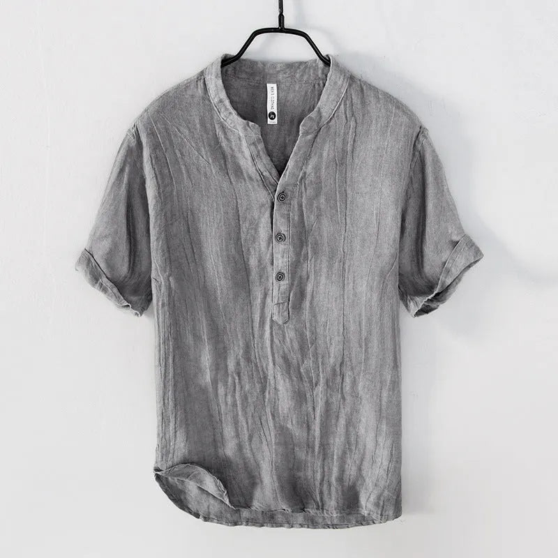 Retro-style short sleeve linen pullover top in a solid neutral colour on a hanger.
