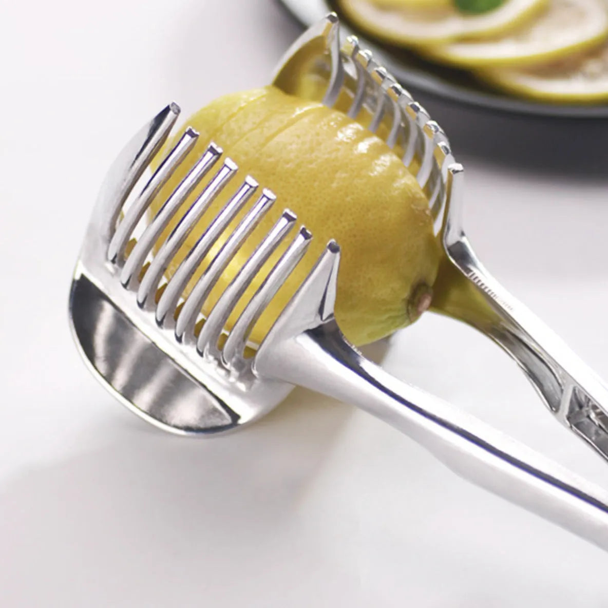 Silver plastic lemon slicer kitchen gadget showing folder design
