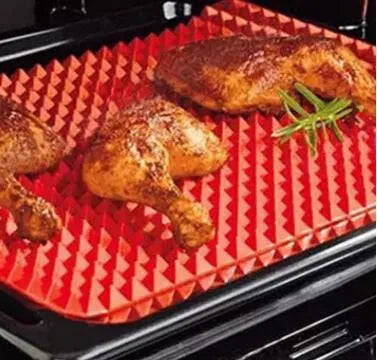 Red silicone pyramid cooking mat with grid pattern for oven and BBQ use