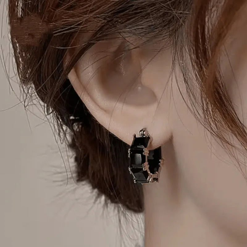 Geometric U-shaped zircon ear rings with electroplated gold finish on copper construction