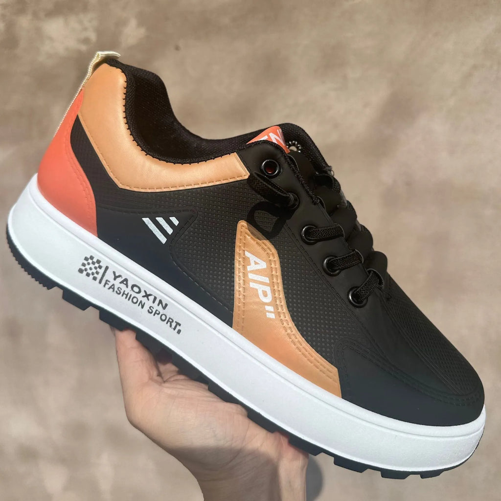 Men's casual shoes with round toe design in artificial PU material, showing white with orange accent colour option