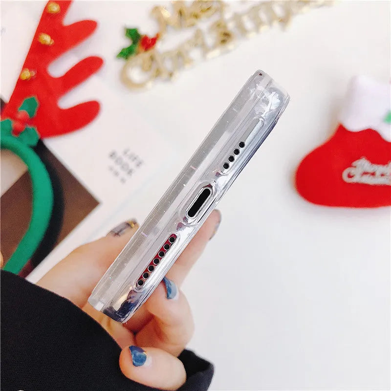 Transparent Christmas quicksand iPhone case with Santa Claus snowflake design on iPhone
